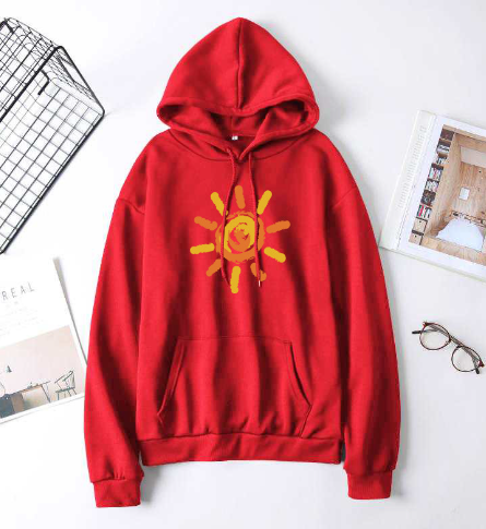 Red hoodie with a yellow sun design on a white surface